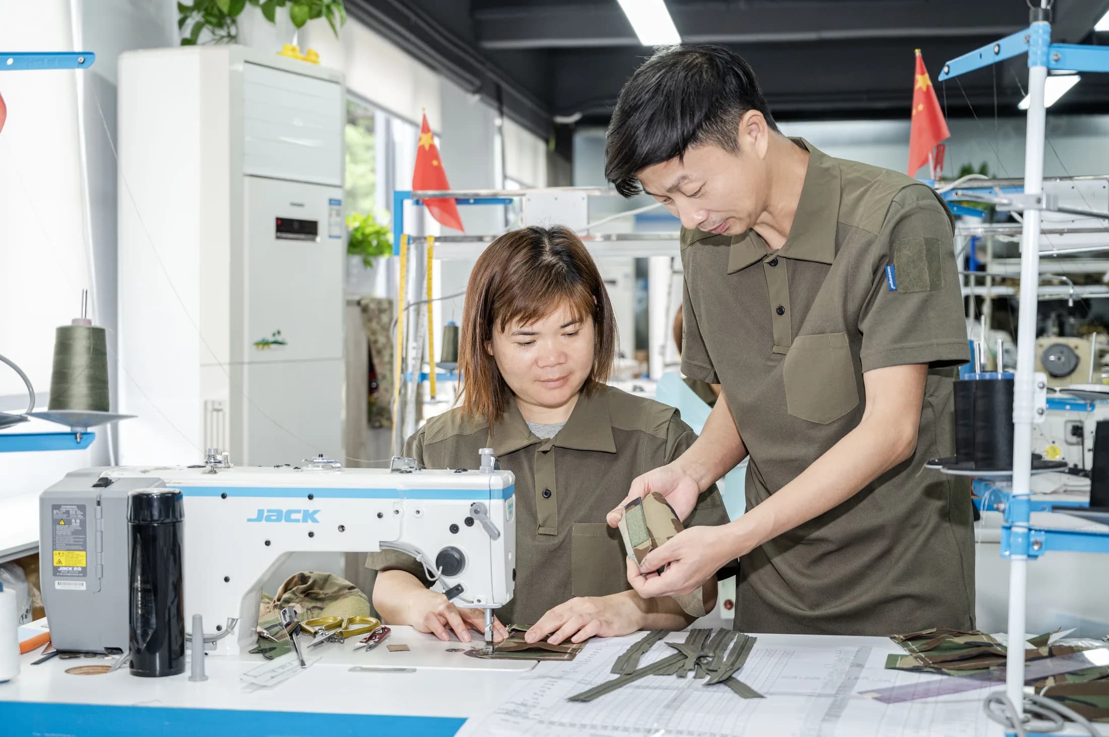 Emersongear team reviewing tactical garment sample construction