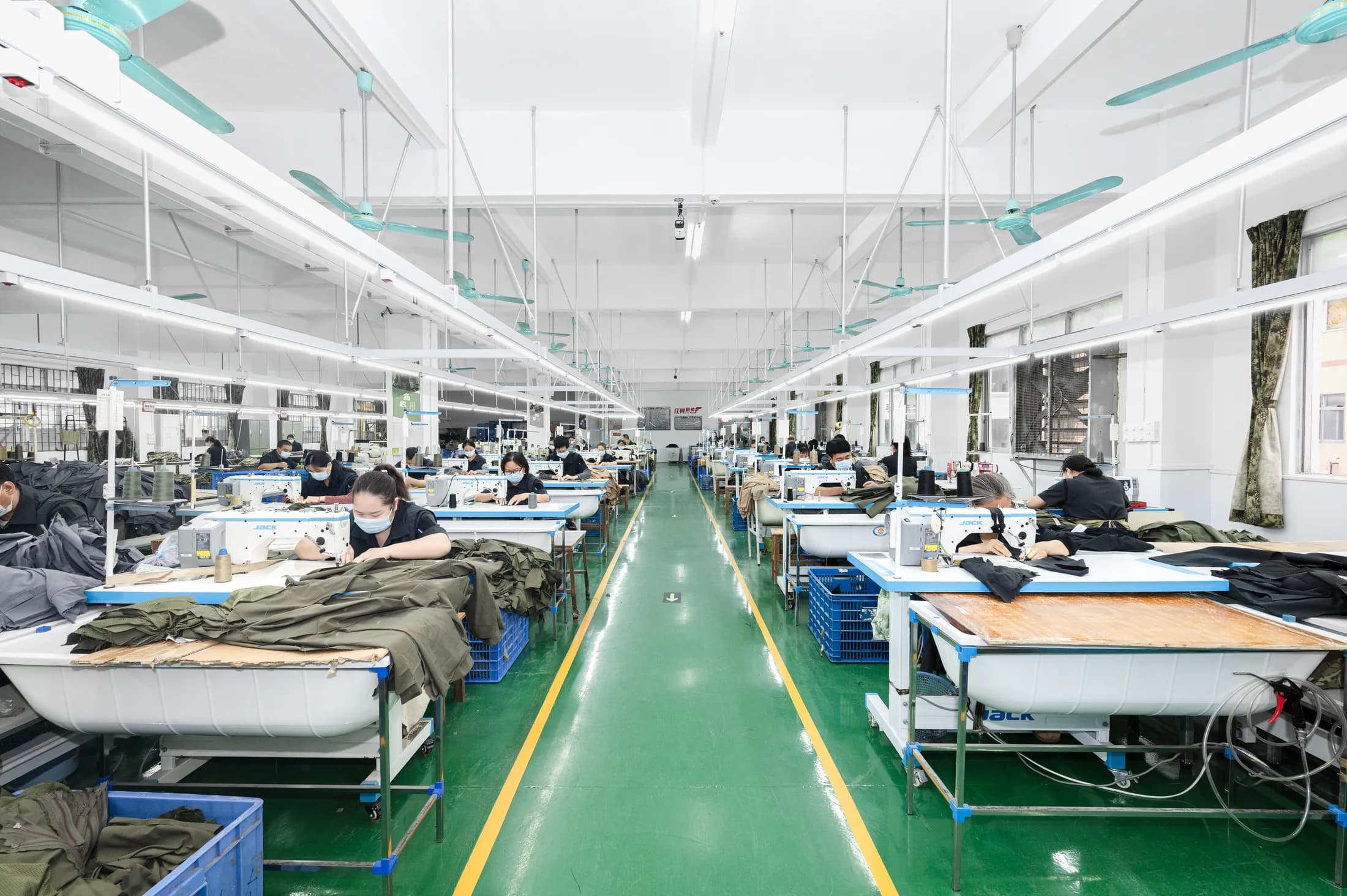 Dongguan Red Wing tactical apparel production factory with organized sewing lines