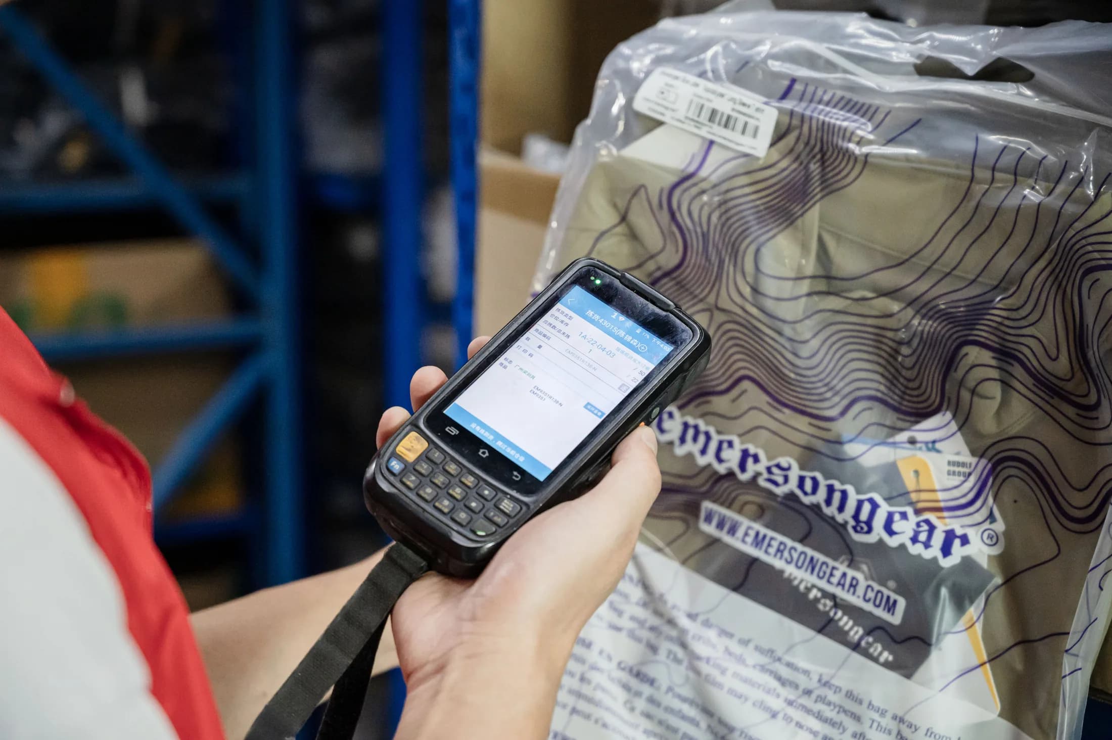 Warehouse staff scanning an Emersongear packaged product for inventory handling